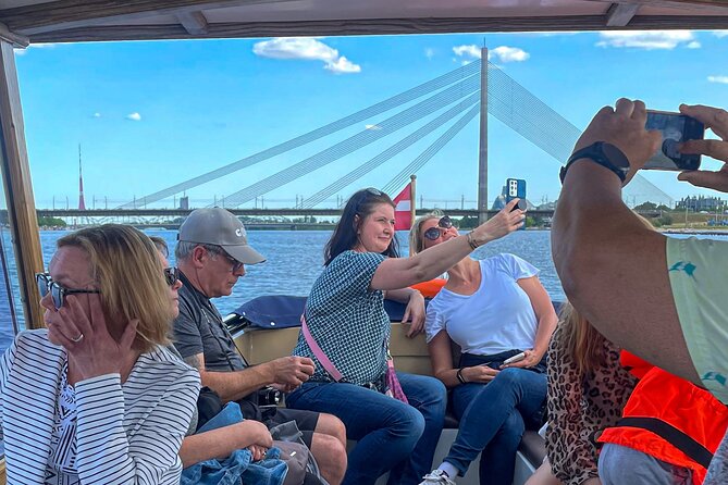 Riga Sightseeing Tour by Canal Boat with Audioguide - Central Market, the National Library, and the Daugava